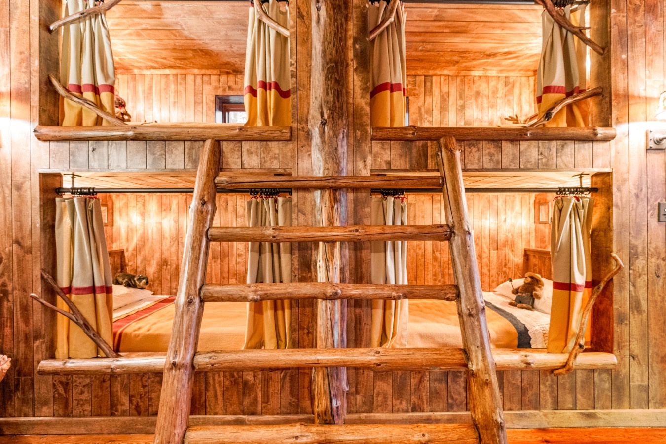 Your rustic wood bunk beds offer cozy privacy with curtains, perfect for sharing space while keeping personal comfort.
