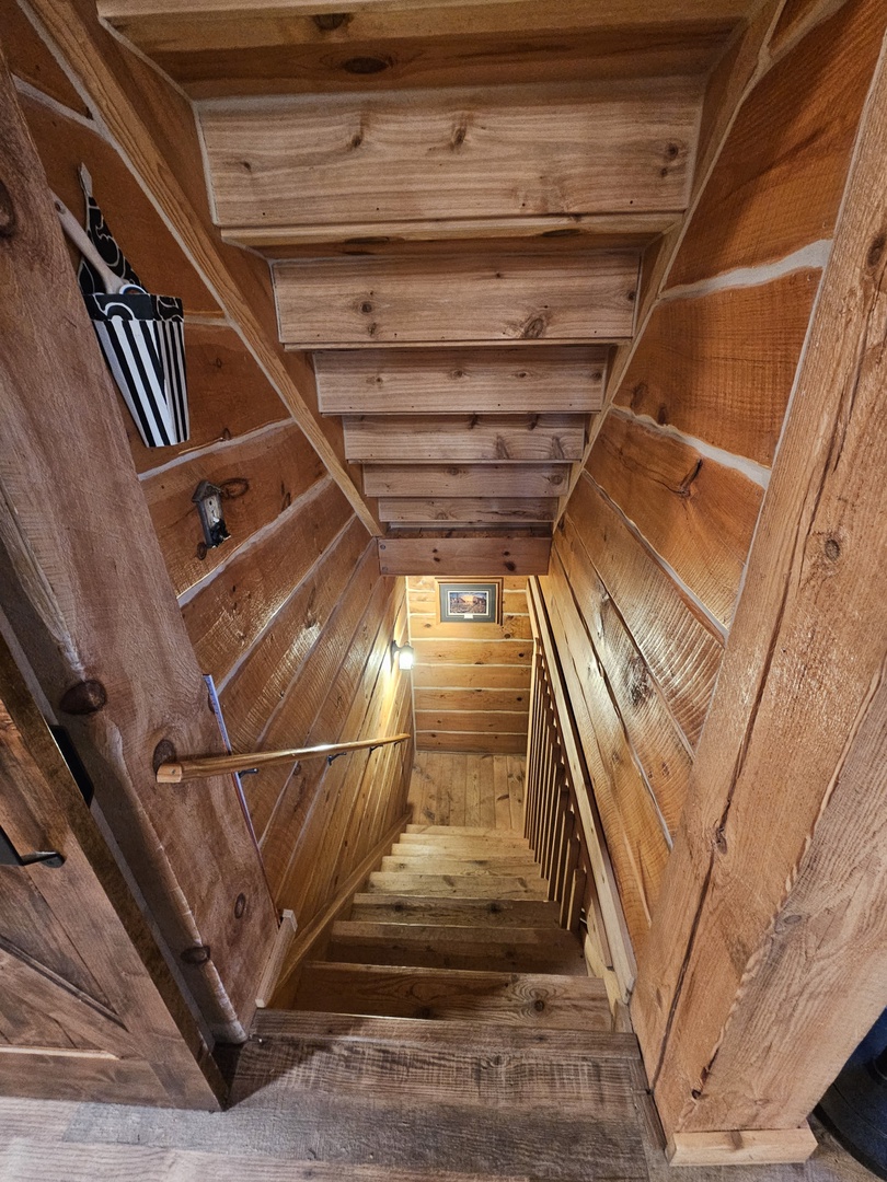 Warm wood staircase leads you between levels, wrapped in rustic charm and mountain character.