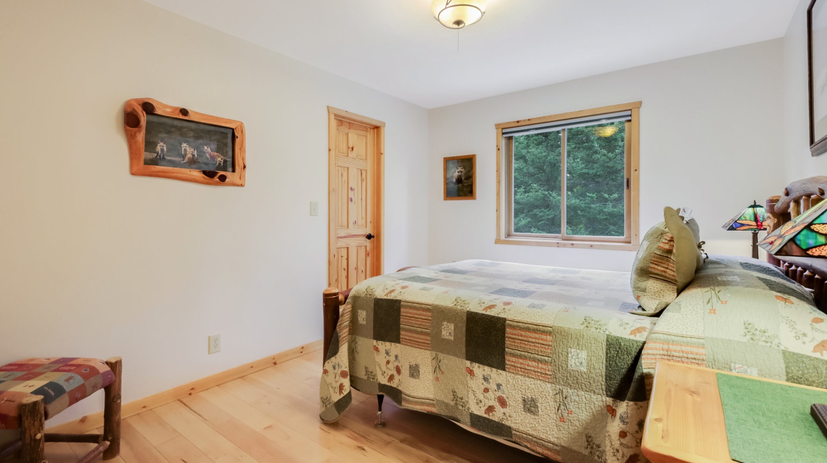 Rest peacefully in your cozy bedroom with handcrafted wooden touches, forest views, and charming rustic details that create the perfect mountain retreat.