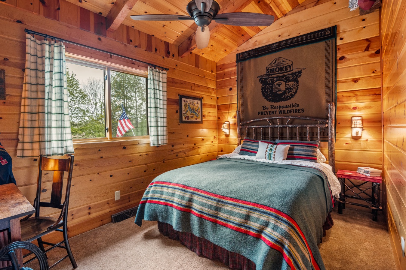 Rest in this cozy log cabin bedroom where rustic charm meets comfort with handcrafted furniture and warm wood walls.