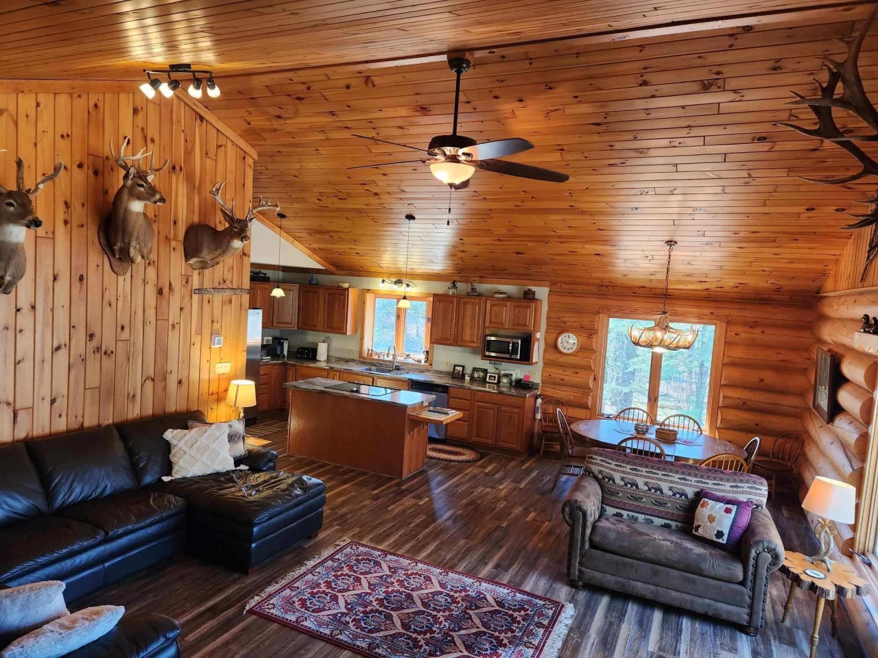 Your rustic cabin features warm wood throughout, with a full kitchen, cozy living area, and mountain lodge charm.