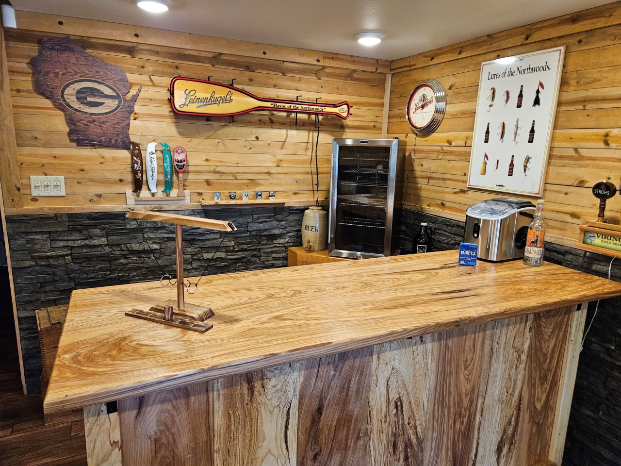Unwind in your rustic home bar with authentic Wisconsin charm, complete with beer fridge and local sports memorabilia.