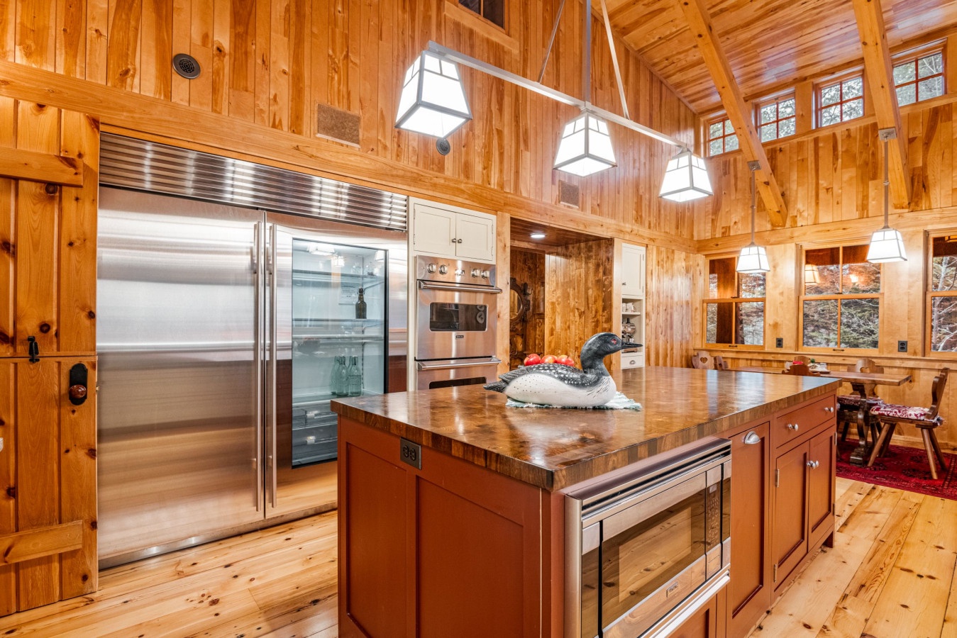Your dream cabin kitchen awaits with gleaming stainless appliances, warm wood beams, and rustic charm perfect for memorable mountain meals.