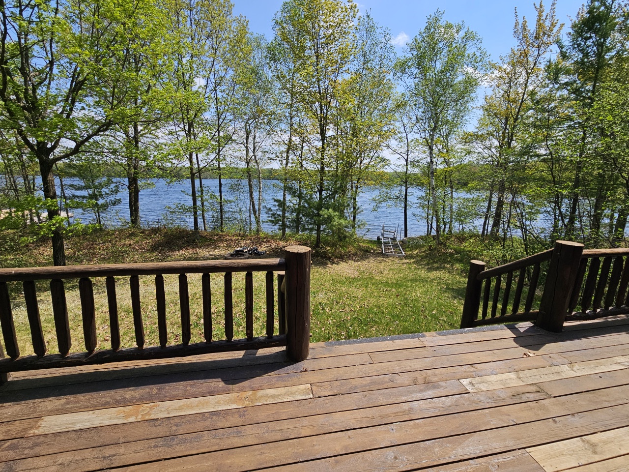 Step onto your private deck and soak in stunning lake views through towering trees. Perfect for morning coffee or sunset relaxation.