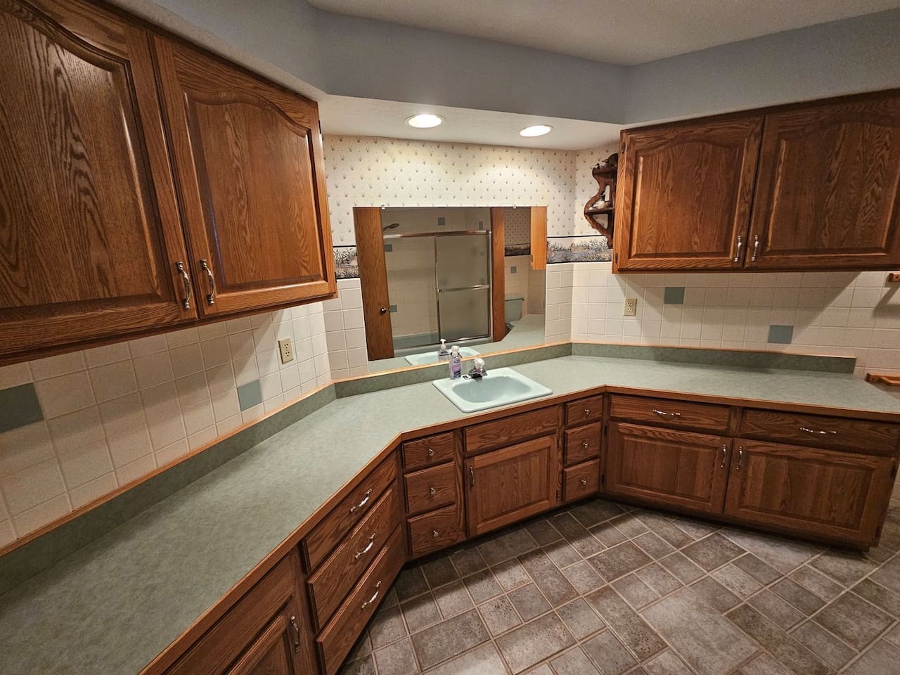 Your fully equipped kitchen features rich wood cabinetry, ample counter space, and everything you need to prepare delicious home-cooked meals.