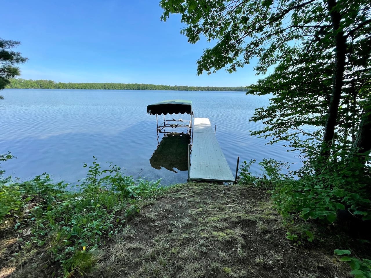 Step onto your private dock where peaceful lake waters and shaded forest surroundings create the perfect retreat for morning coffee or evening relaxation.