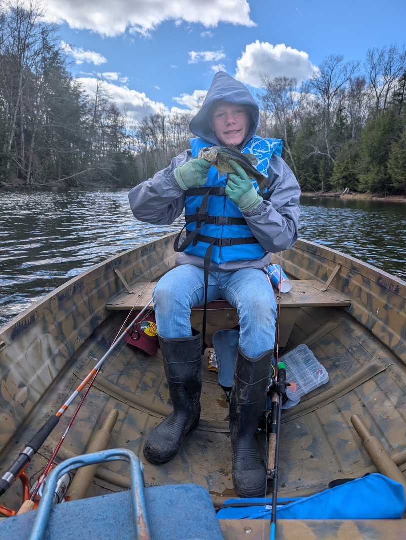 A peaceful river scene surrounded by trees, offering a serene natural setting near the property—ideal for outdoor adventures.