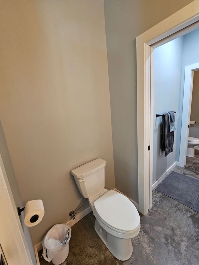 Your private powder room offers convenient comfort with modern fixtures and neutral tones for a peaceful retreat.