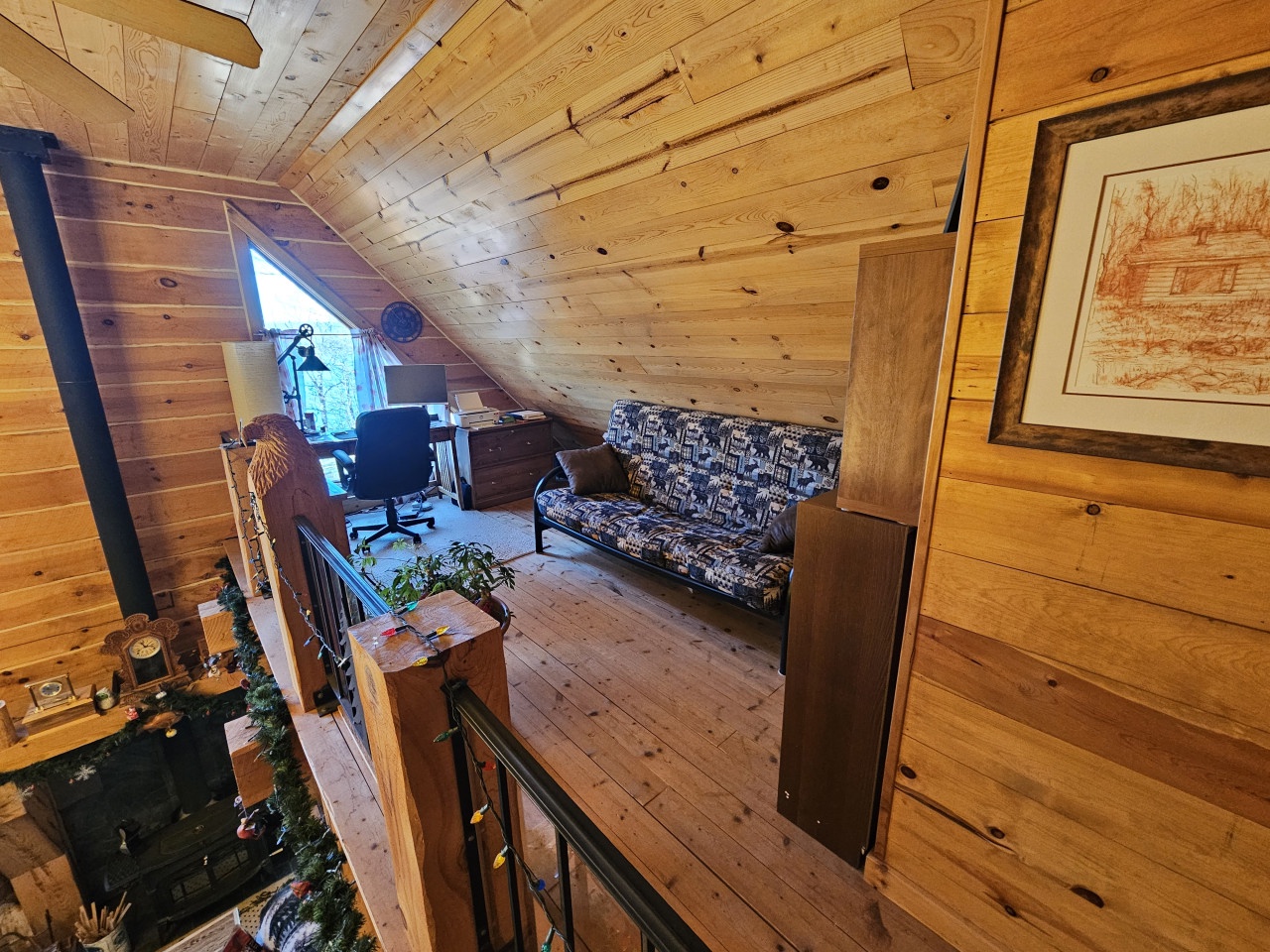 Tuck into your own cozy wood-lined loft nook with a comfy sofa where you can read, work, or simply relax under charming sloped ceilings.