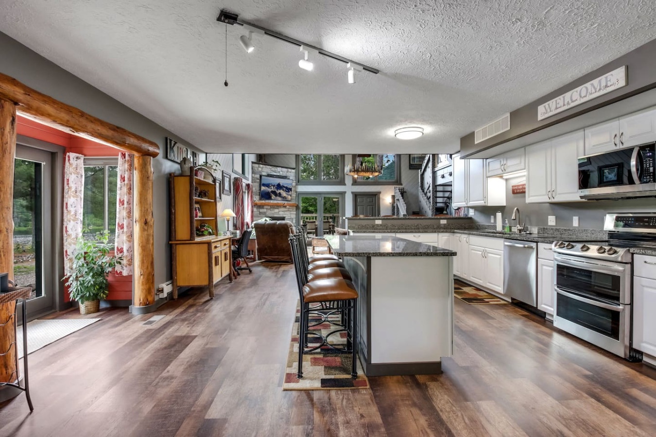 Your spacious kitchen features granite countertops, modern appliances, and a welcoming island where you can gather for meals and conversations.