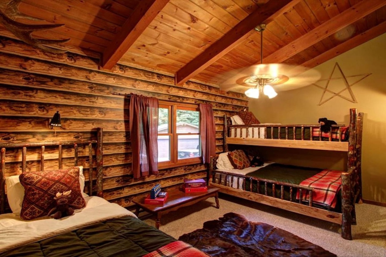 Cozy up in your rustic cabin bedroom with handcrafted log walls, warm wooden beams, and comfy bunk beds perfect for family adventures.