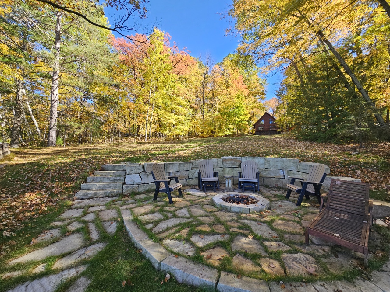 Gather around your private fire pit surrounded by vibrant autumn foliage, where crisp evenings become magical moments under the stars.