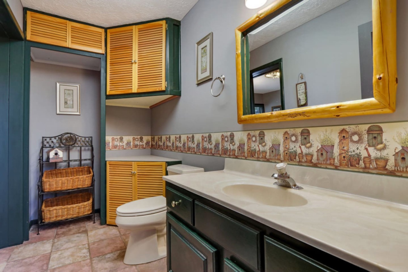Your private bathroom features charming rustic details with plenty of counter space and convenient storage throughout.