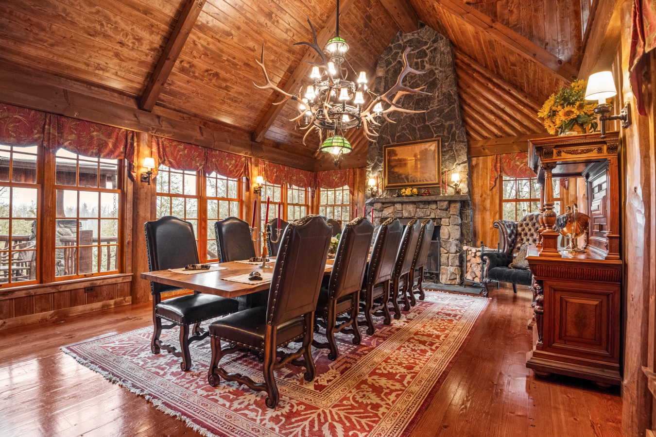 Gather around this grand dining table where warm wood and stone create the perfect setting for memorable meals together.