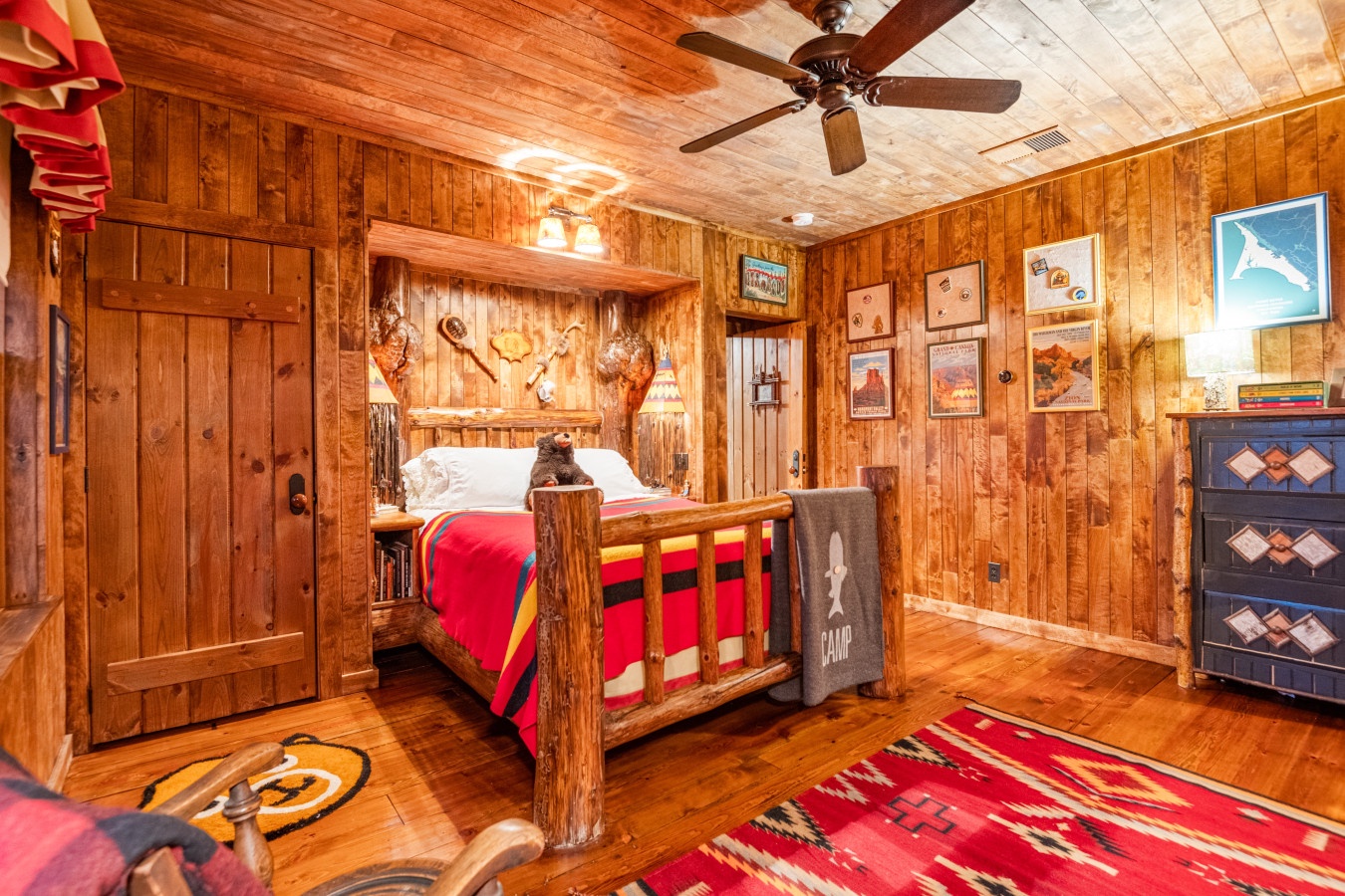 Sleep surrounded by rustic wood walls and Southwest charm. Your cozy log bed and colorful Native American textiles create the perfect mountain retreat atmosphere.