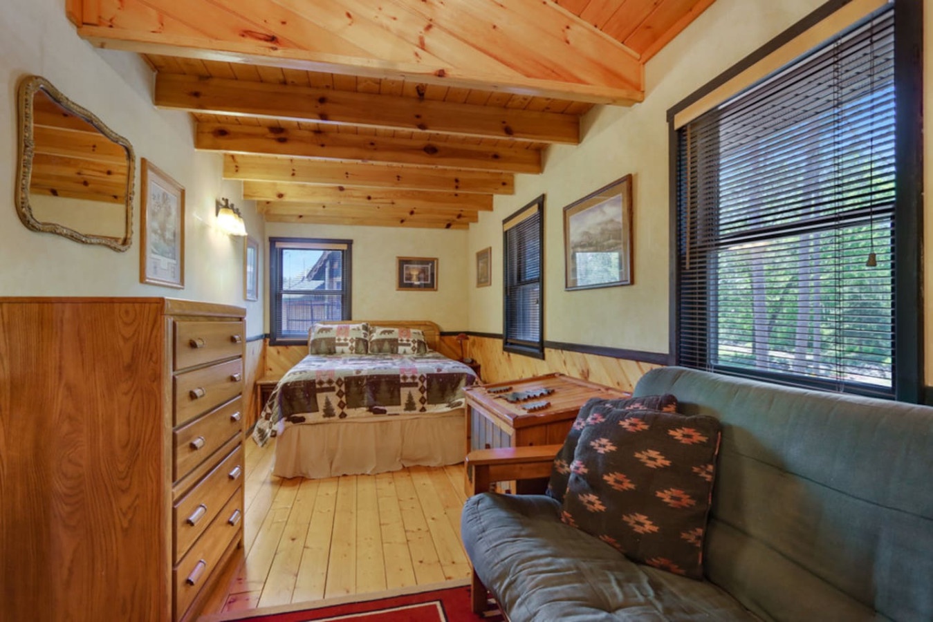 Cozy rustic bedroom with exposed wooden beams, soft natural light, and peaceful garden views for your mountain retreat.