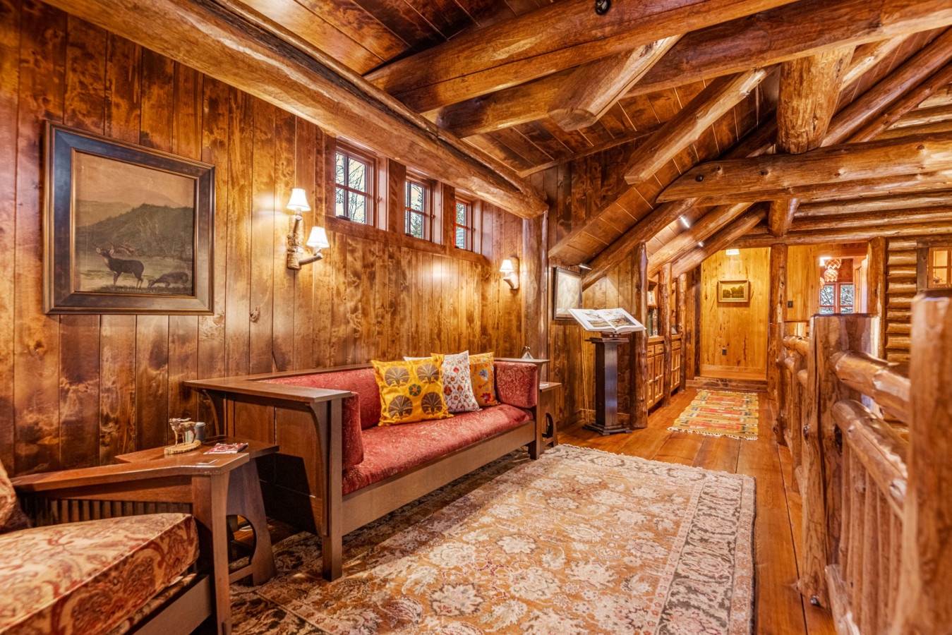 Cozy up in this stunning log cabin living room with rustic beams, warm lighting, and inviting seating perfect for your mountain retreat.