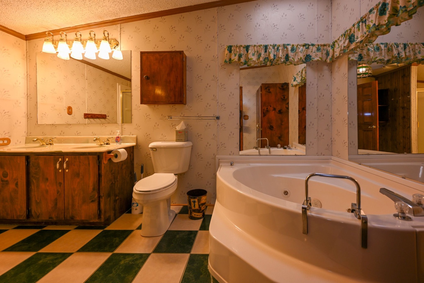 Unwind in your spacious bathroom featuring a luxurious jetted tub, perfect for soaking after exploring the area.