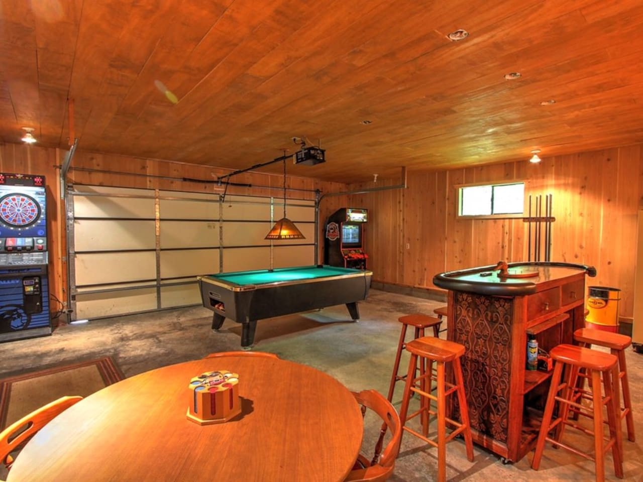 Your private game room awaits with pool table, darts, and cozy bar—perfect for friendly competitions and evening entertainment.