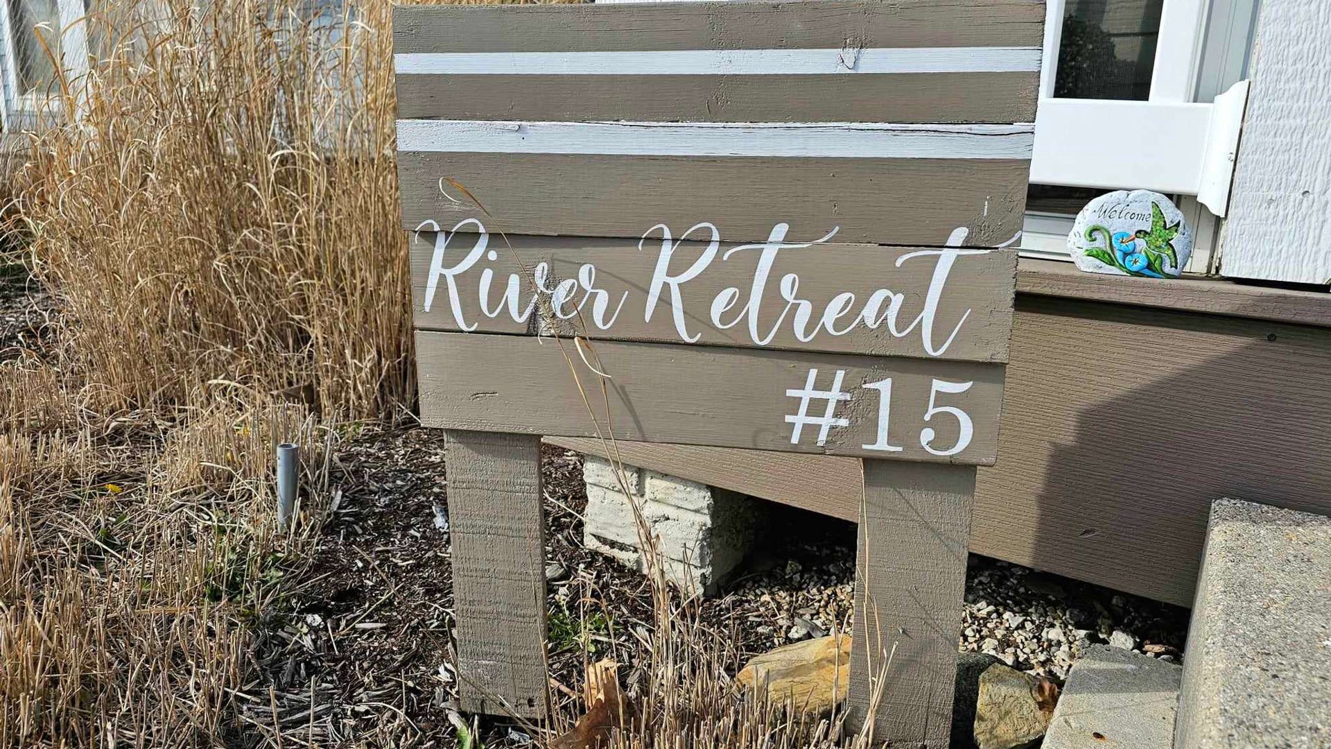 River Retreat #15 welcomes guests with rustic charm and natural surroundings.