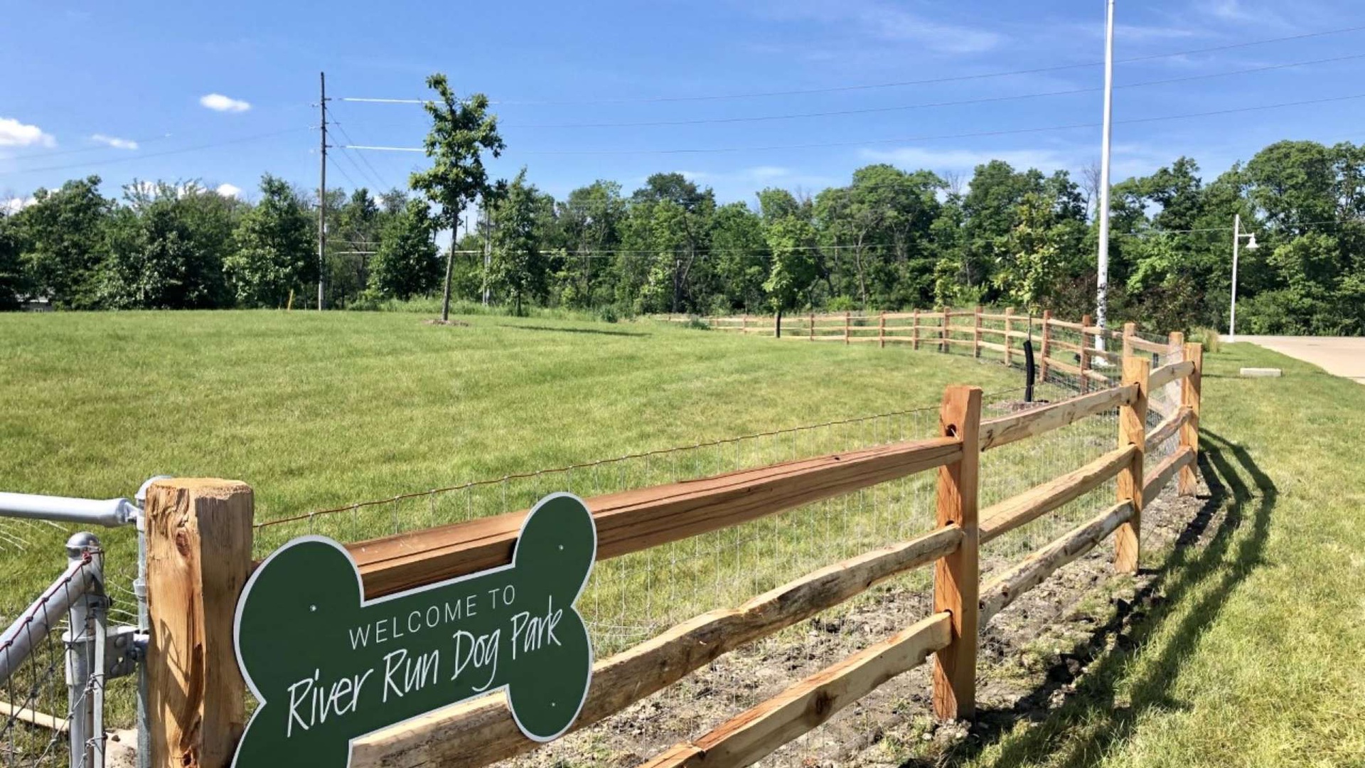 Welcome to River Run Dog Park - a dedicated off-leash area where your furry companions can play freely in open green spaces.