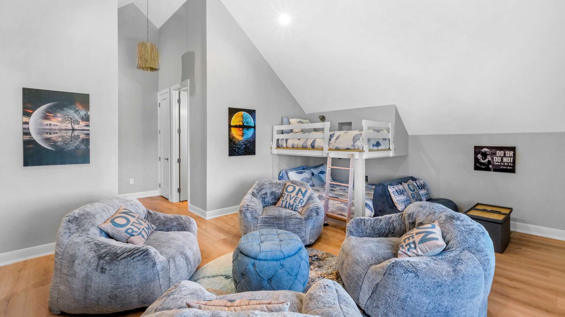 Your kids will love this cozy bedroom with comfy bean bags and a fun white bunk bed perfect for sleepovers and adventures.