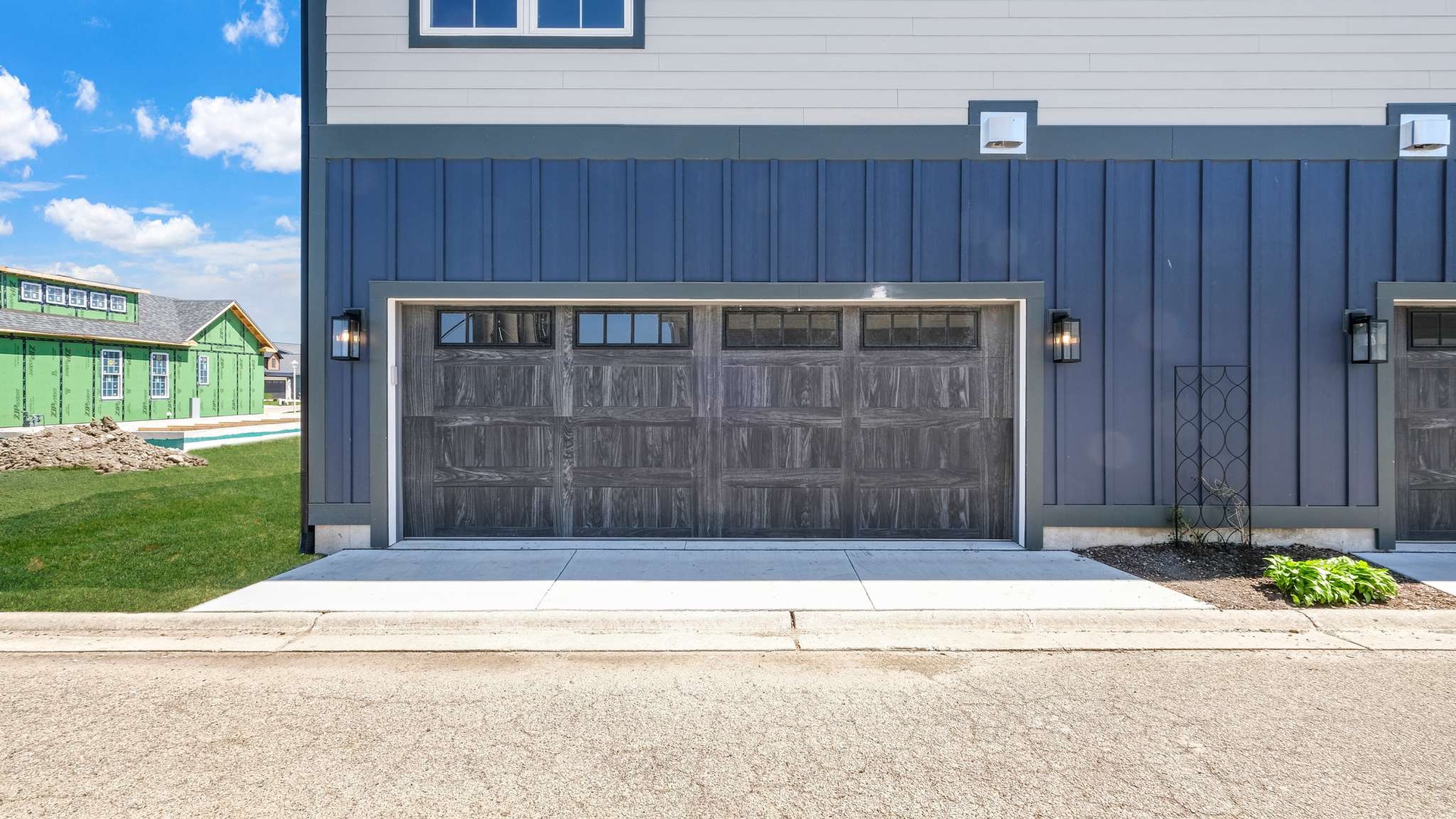 Modern garage entrance provides convenient parking for your stay in this well-appointed neighborhood.