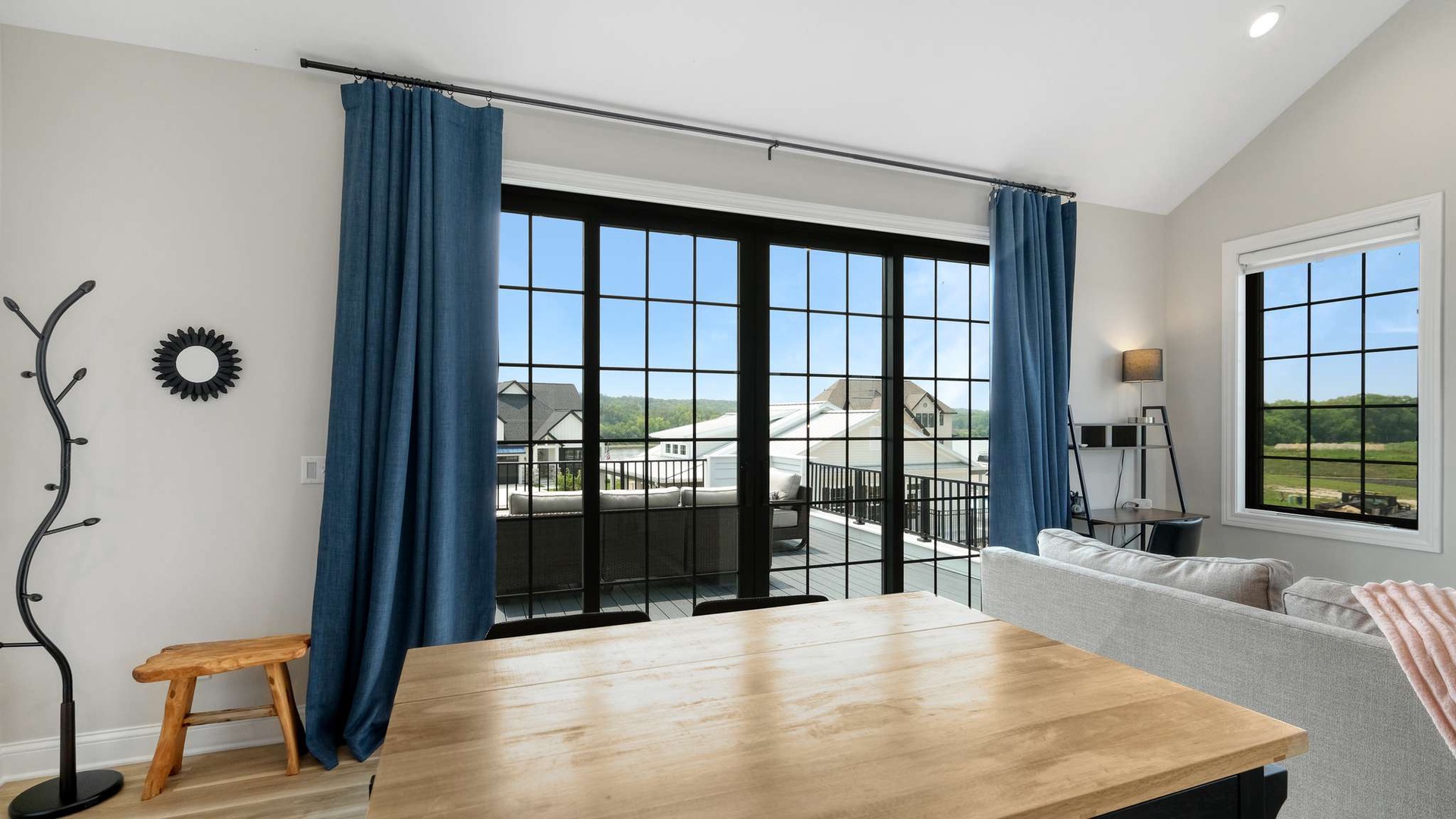 Unwind in your bright living space with stunning balcony views and cozy seating perfect for morning coffee or evening relaxation.