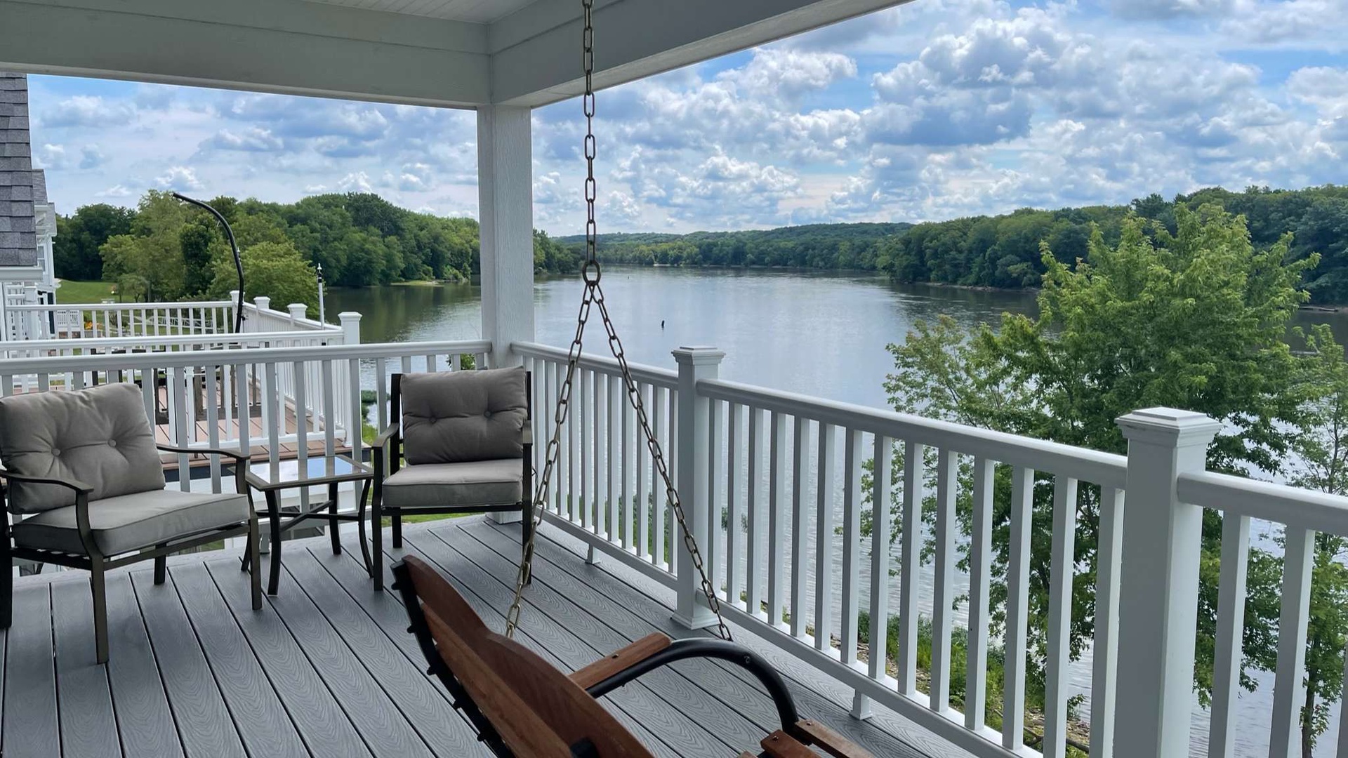 Relax on your private lakefront deck with comfortable seating and a peaceful porch swing overlooking pristine waters.