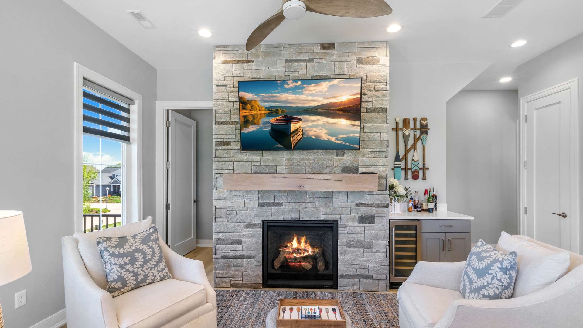 Unwind in your elegant living space featuring a cozy fireplace and entertainment center, perfect for relaxing evenings together.
