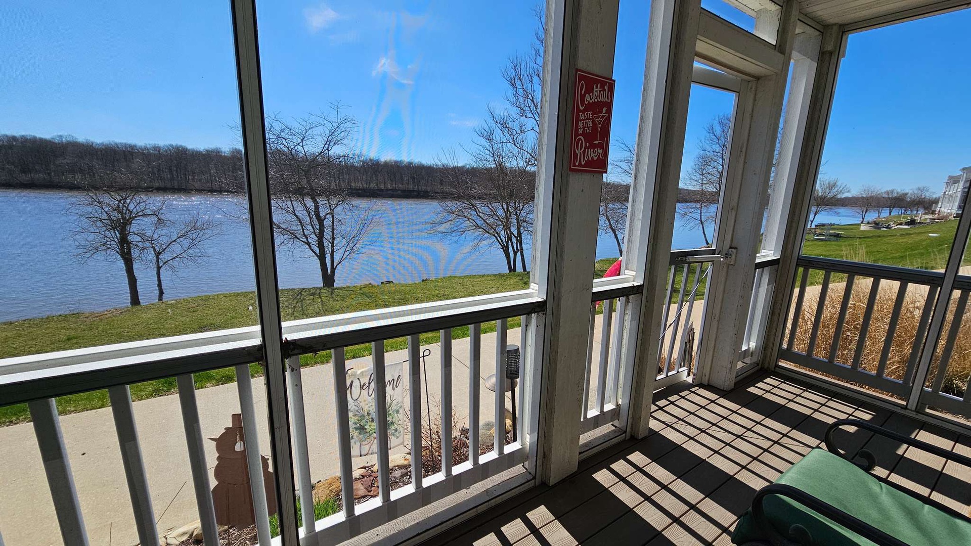 Relax in your screened porch while enjoying stunning lake views and peaceful waterfront scenery through panoramic windows.