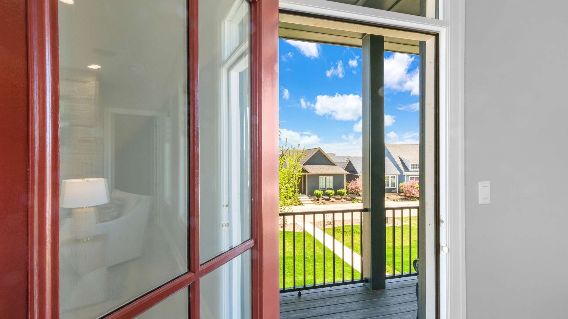 Open your balcony doors to breathe in fresh air while enjoying peaceful neighborhood views and abundant natural light.