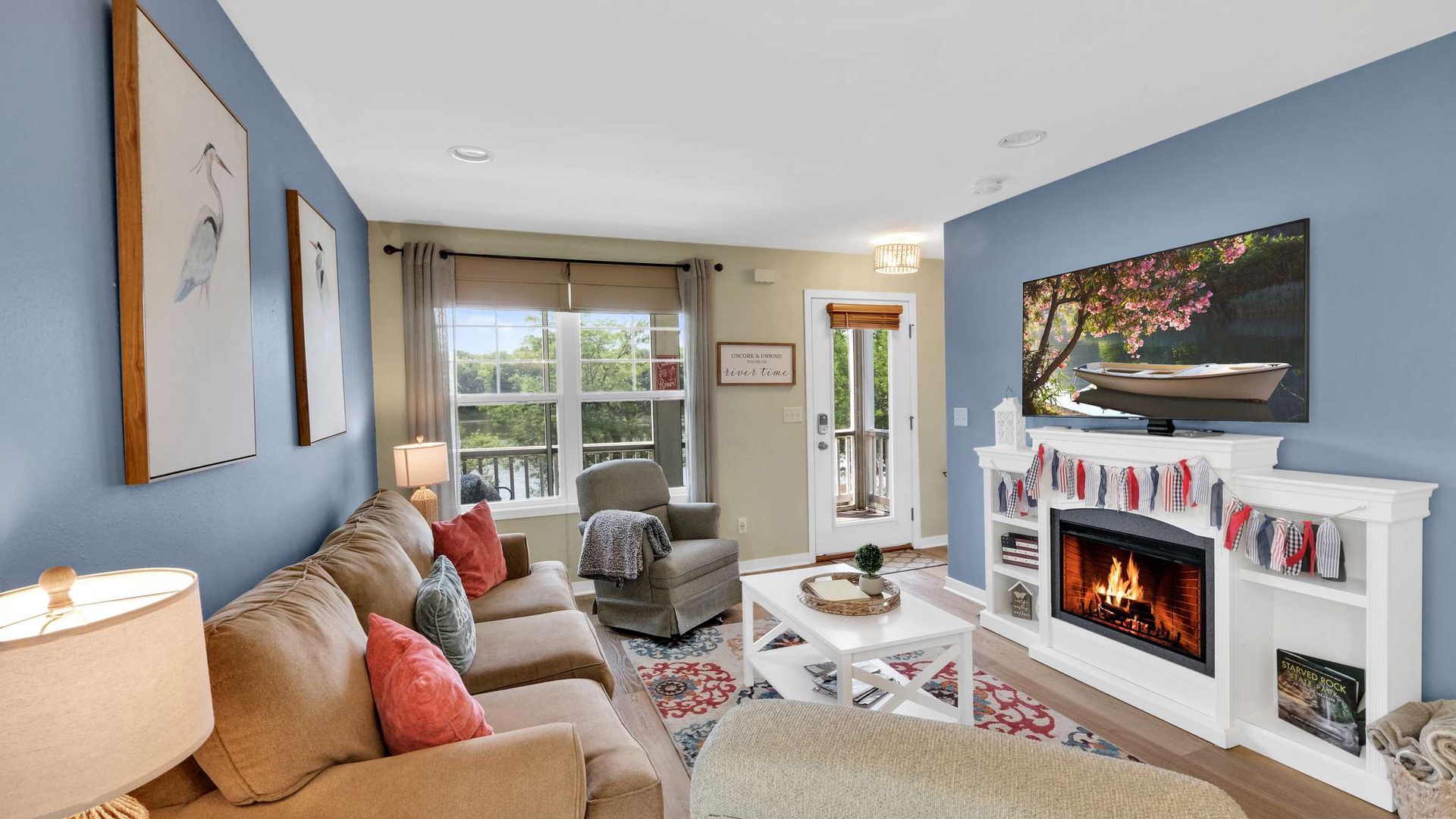 Cozy up by your crackling fireplace while enjoying peaceful views from this bright, thoughtfully decorated living space.