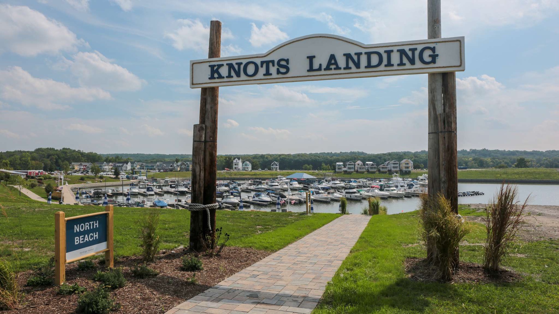Knots Landing marina entrance with boats and waterfront access along the scenic shoreline.