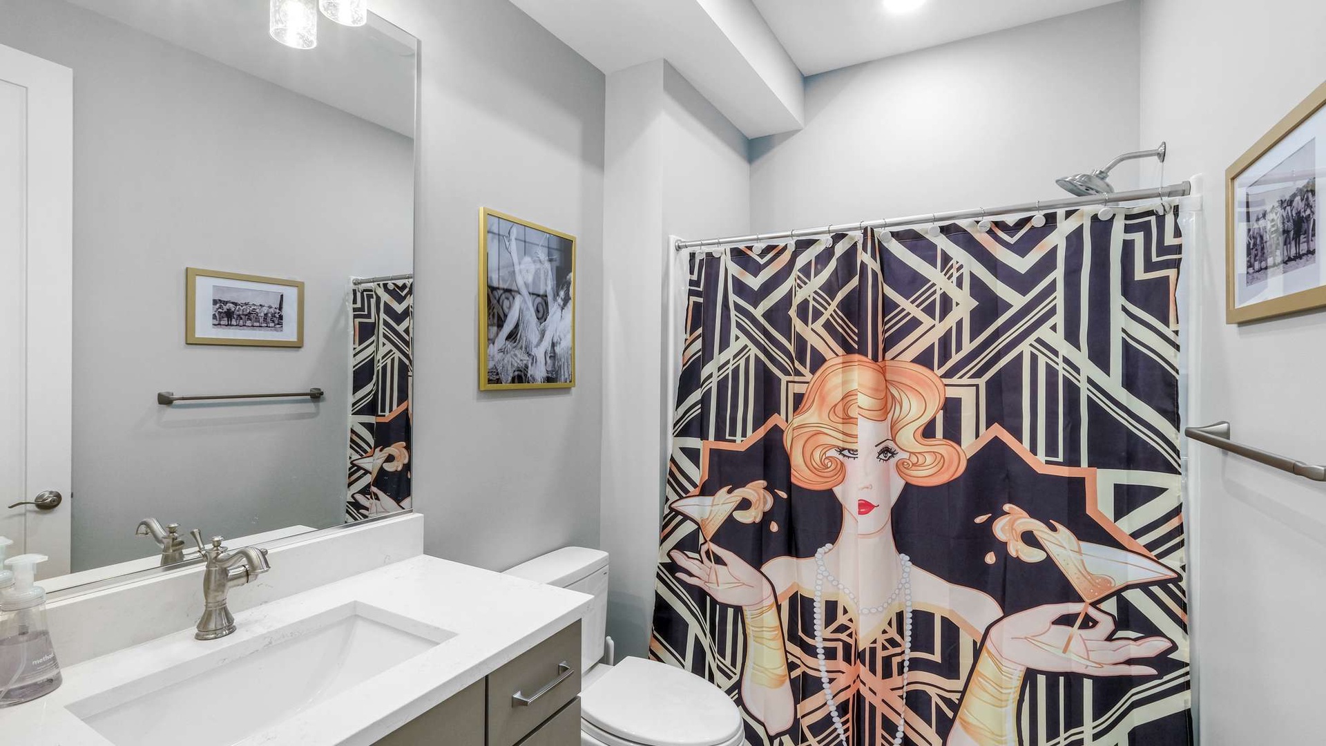 Step into your stylish Art Deco bathroom, where vintage glamour meets modern comfort with a stunning shower curtain and elegant fixtures.