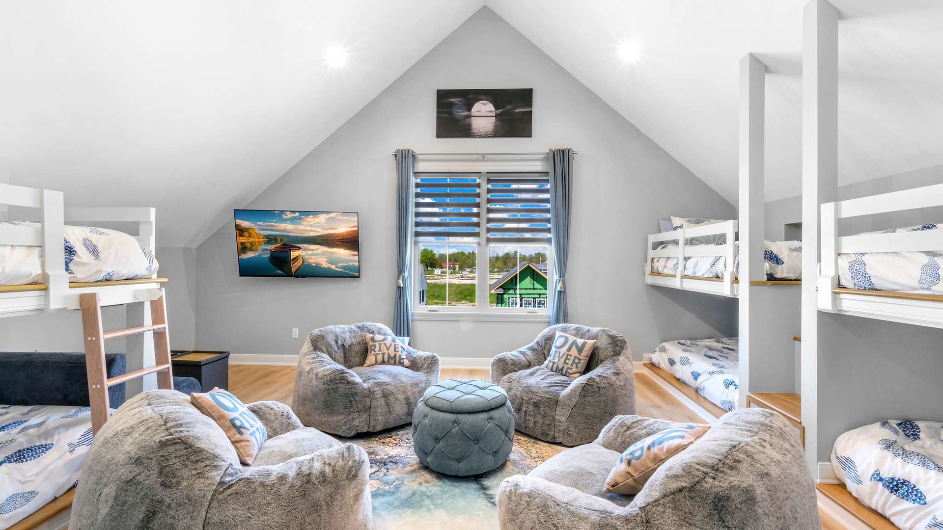 Cozy up in this charming loft space with plush seating and bunk beds, perfect for family gatherings and relaxation.