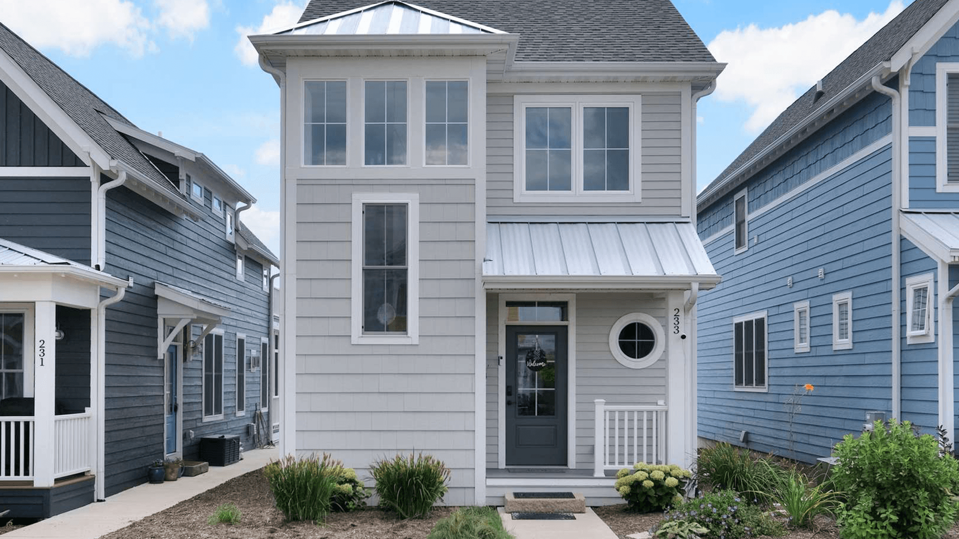 Modern coastal-style home featuring bright interiors and thoughtful design, perfectly positioned in a charming neighborhood setting.