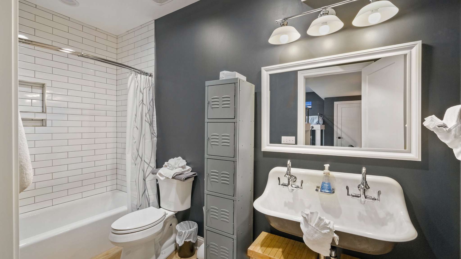 Step into your stylishly updated bathroom with classic subway tile, vintage-inspired fixtures, and thoughtful storage solutions for a refreshing start to each day.