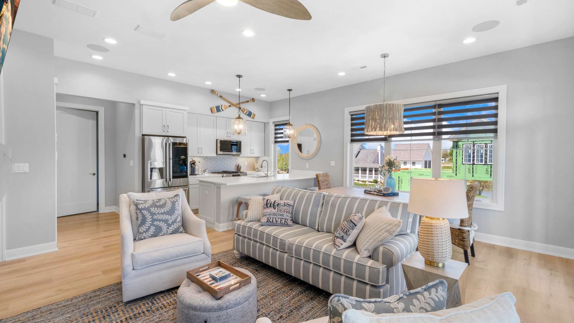Sink into this stylish open-concept space where your living room flows into a fully equipped kitchen, perfect for relaxing evenings and morning coffee.