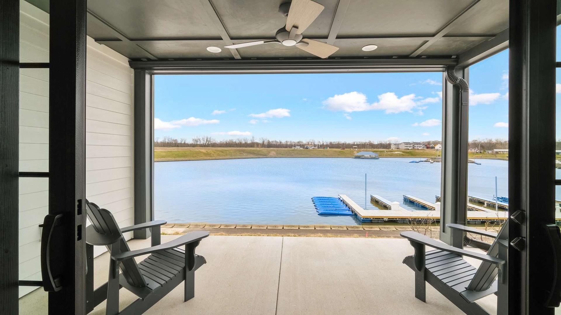 Relax on your private covered patio overlooking the serene lake, where peaceful mornings and stunning water views await.