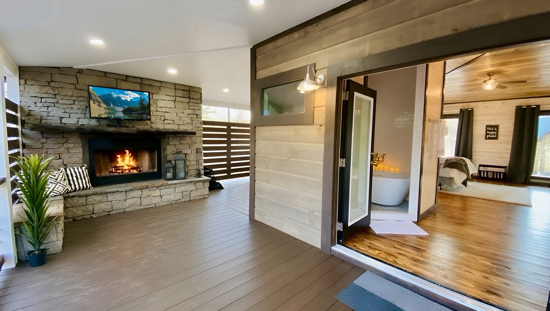 Warm wood floors and a crackling stone fireplace welcome you into your modern retreat, where rustic charm meets comfort in every corner.
