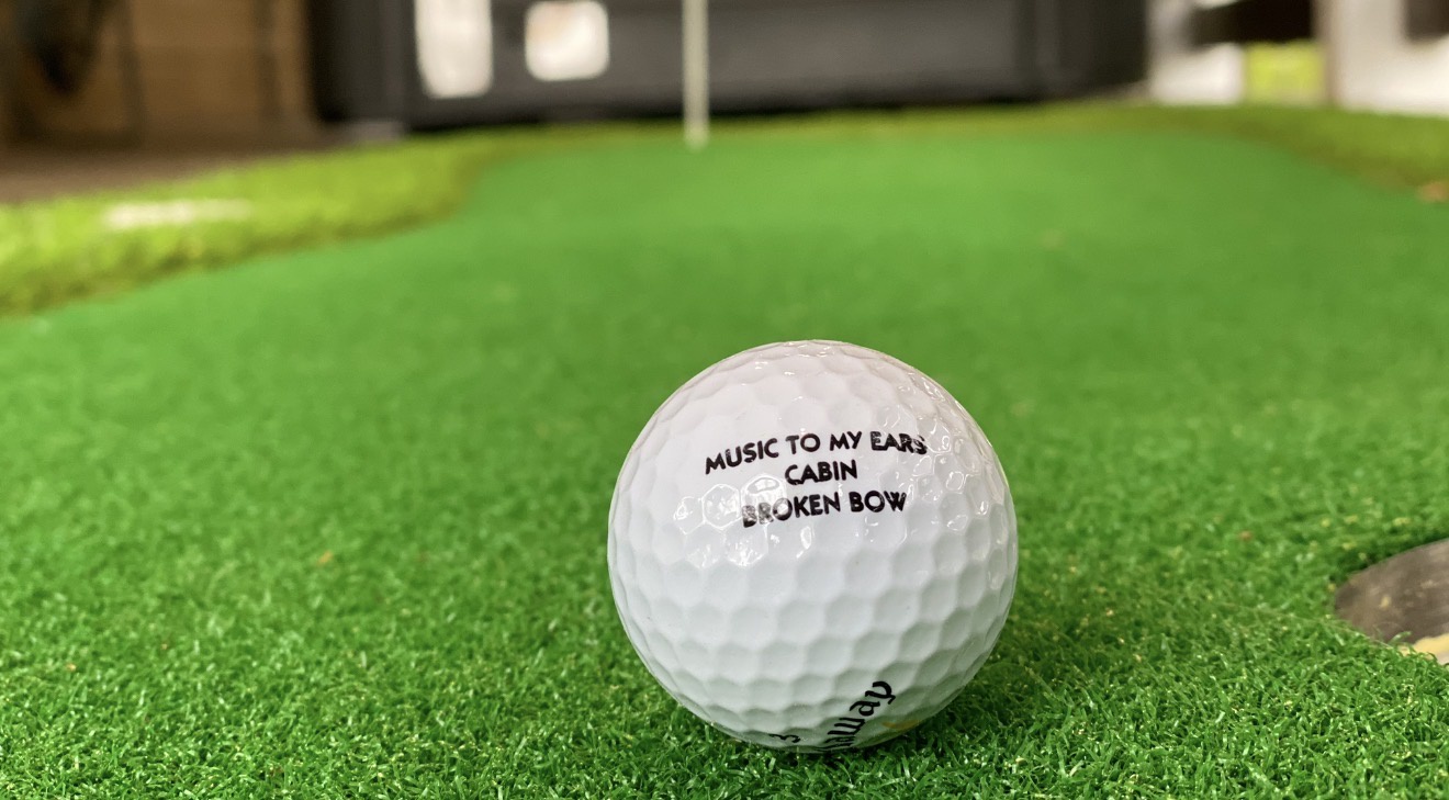 Test your swing on the indoor putting green—perfect for honing your skills between adventures.
