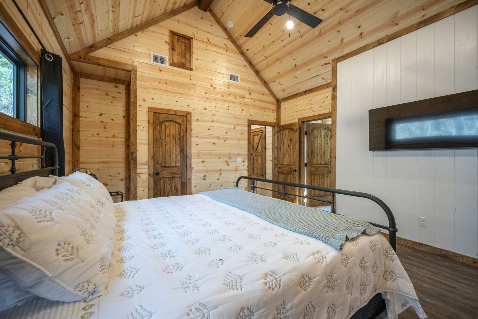 Drift off to sleep in your cozy loft bedroom with soaring timber ceilings and rustic charm that makes every night feel like a retreat.