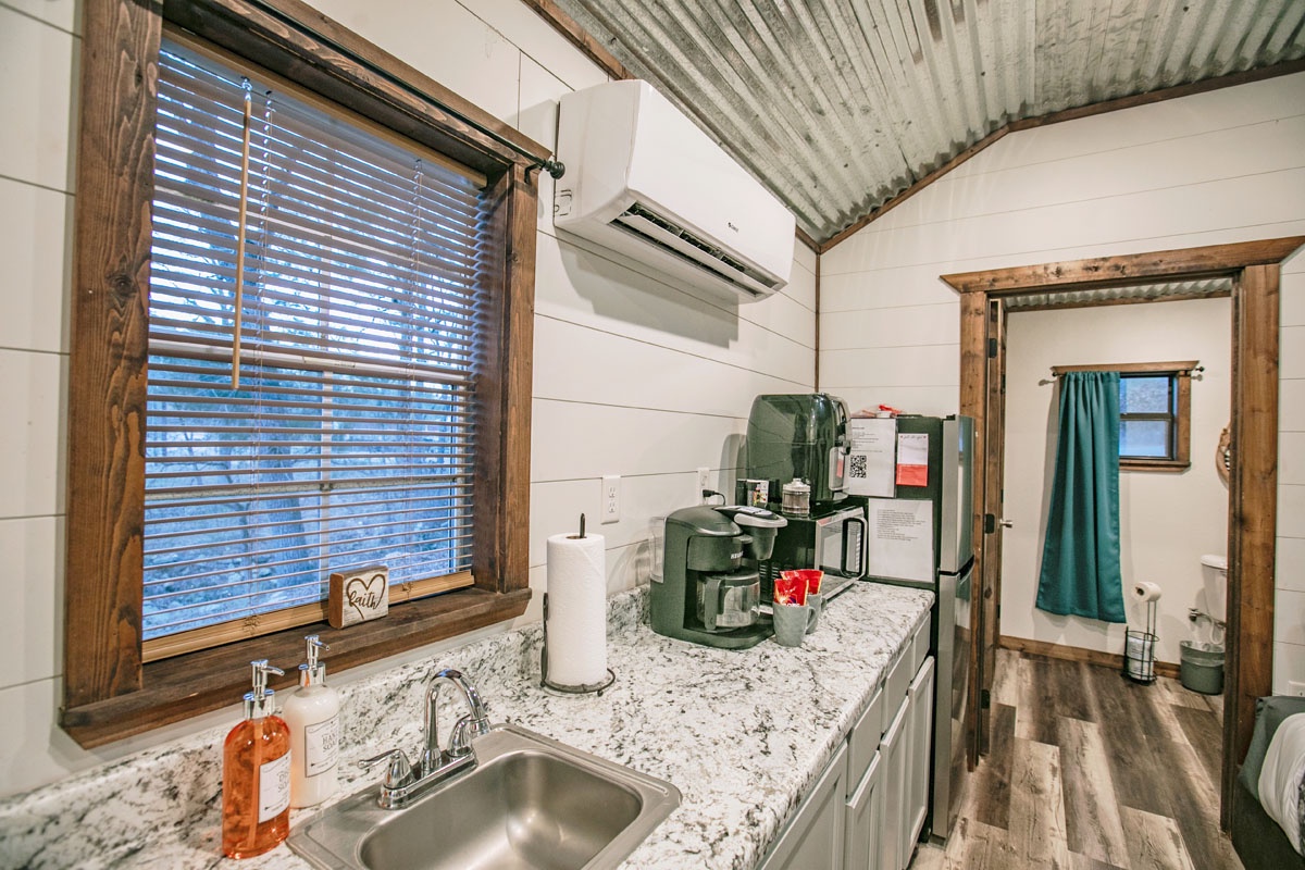 Your cozy kitchenette features granite counters, modern appliances, and rustic charm—perfect for brewing morning coffee before exploring.