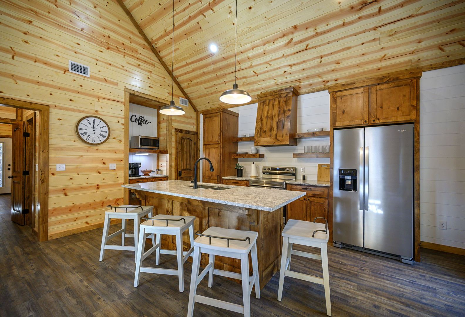 Your fully equipped rustic kitchen invites you to cook with modern appliances while enjoying the warmth of natural wood throughout.