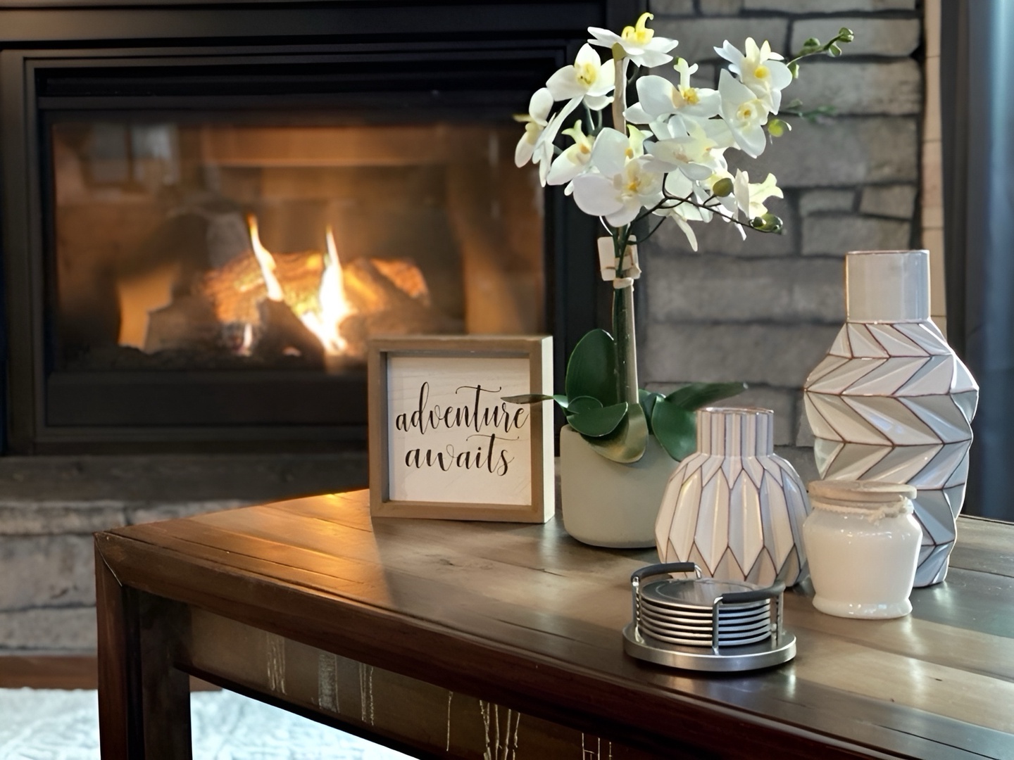 Curl up by the fireplace and let adventure await in your cozy retreat, where warm flames and thoughtful decor invite you to truly unwind.
