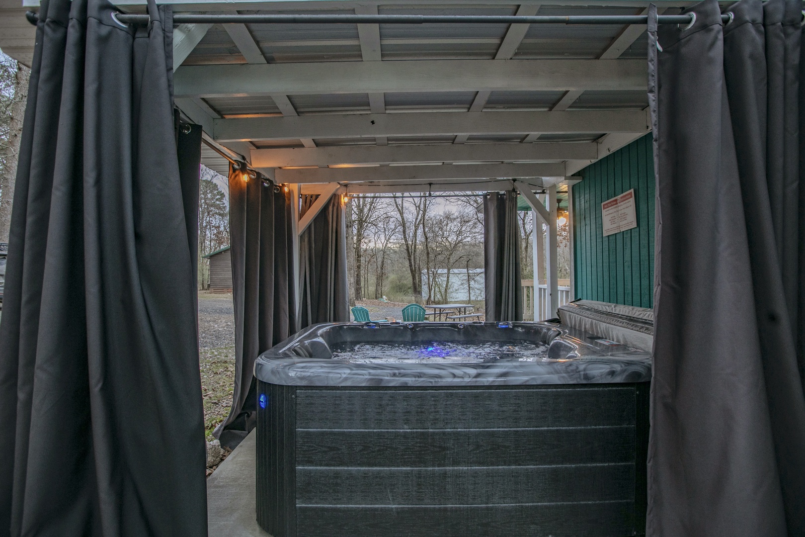 Slip into your private hot tub on the covered patio, where warm bubbles and gentle lighting create your perfect evening escape.