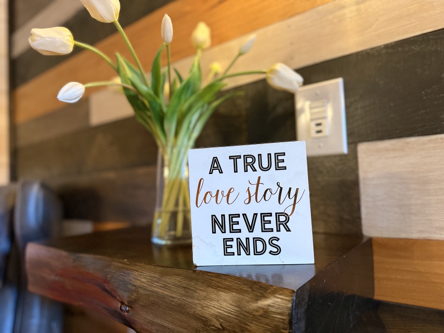 A warm welcome awaits in your bedroom, where fresh tulips and thoughtful touches remind you that every stay here is special.