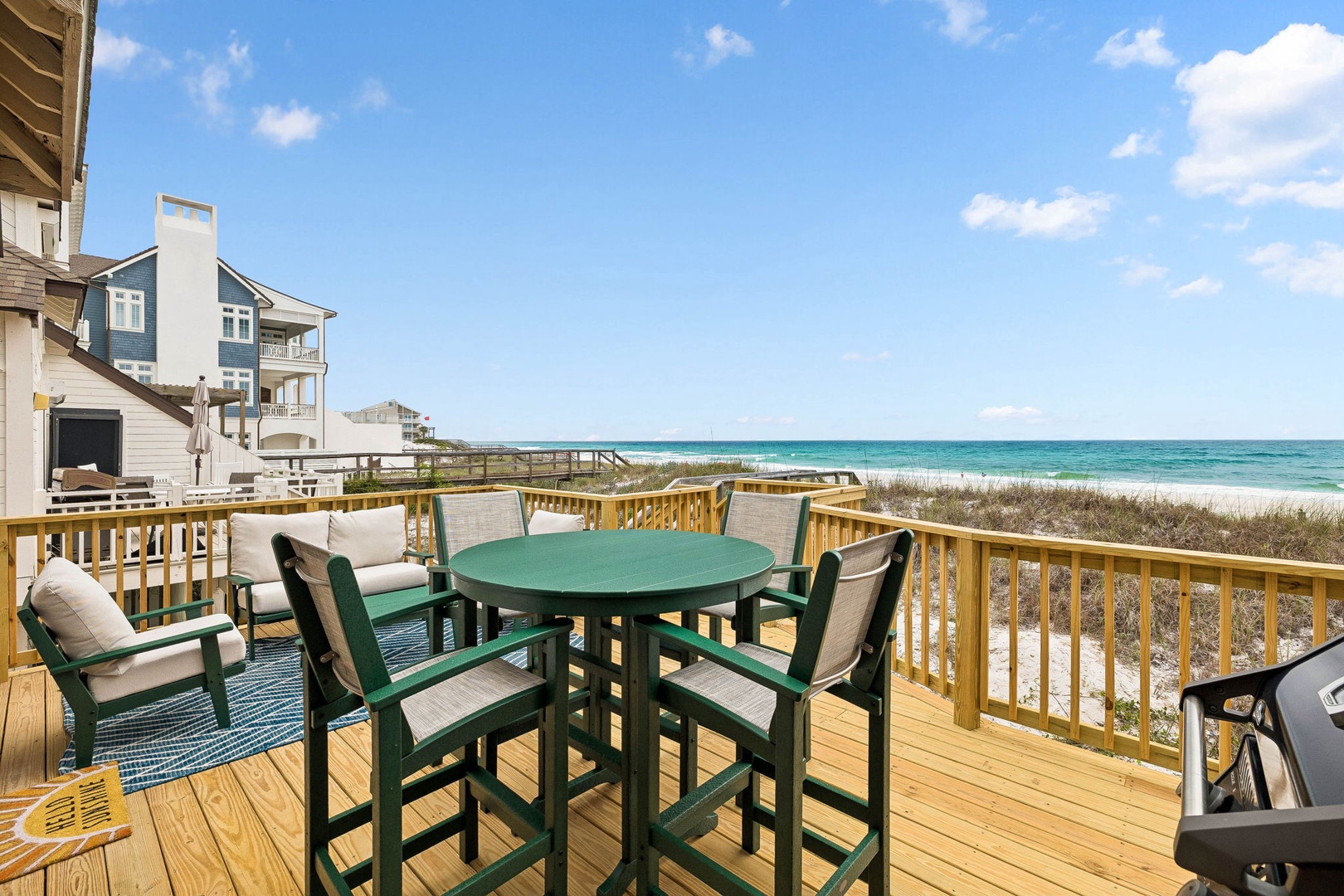 Beachfront deck with turquoise waters and soft sand just steps away, perfect for morning coffee or sunset cocktails with the Gulf as your backdrop.