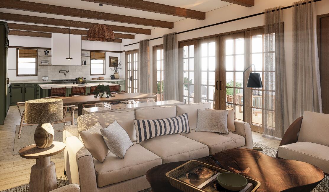 Sink into plush sofas where natural light dances through French doors, creating the perfect space for your morning coffee or evening unwind.